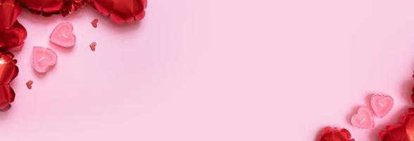 caja de regalo, velas y globos con forma de corazón rojo sobre fondo rosa. fondo del día de san valentín con espacio de copia foto