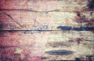 Painted wood background, including red, brown, and black colors photo