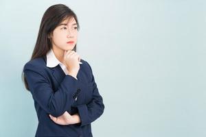 Teenage young girl wearing suit with hand on chin photo