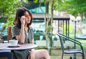 woman sitting in a cafe terrace photo