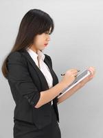 Young women in suit using her digital tablet photo