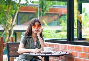 woman sitting in a cafe terrace photo