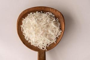 Unsweetened Shredded Coconut on a Wooden Paddle photo
