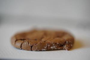 One Chocolate cookie, one salted chocolate brownie cookie. Thin dark cookie. photo