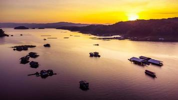 Aerial view of landscape sunset with Reservoir and raft house Thailand