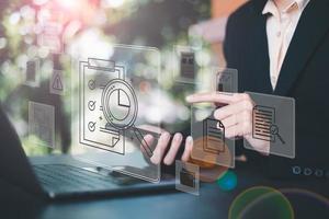 Businessman Audit documents, quality assessment management With a checklist, business document evaluation process, market data report analysis and consulting, plan review process. photo