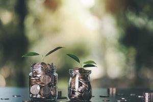 coins in glass jar, finance and banking, fund growth and savings concept, financial efficiency planning, retirement savings, financial freedom,setting goals for saving money for the future photo