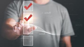 man check mark about exploring topics,In the virtual form check sheet,checklist ideas, checkbox to conduct opinion and quality surveys or satisfaction,Connect and work with modern wireless technology photo