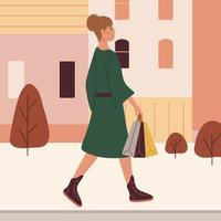 A woman in a green coat carries packages in her hand while walking down the street. vector