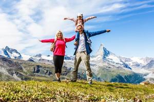 Family trekking, motmother, father and daughter camping photo