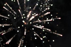 On a black background bokeh from explosions of colorful fireworks. photo