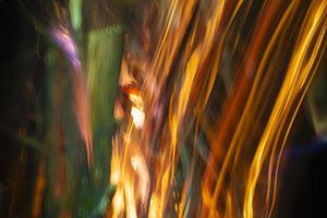 Abstract background of blurred stripes from salute and fireworks. Light multicolored effects. photo