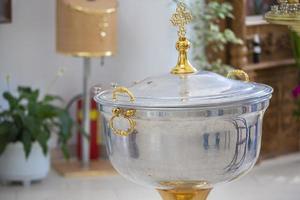 Bowl for Orthodox baptism of children in the temple. photo