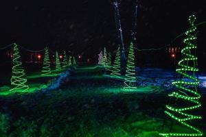 Snowy path in the park illuminated photo