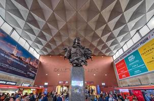 Saint Petersburg, Russia - June 30, 2018 -  Bust of Emperor Peter the First at Moscow railway station with a Saint-Petersburg logo on the wall in the background. photo