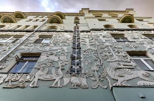 The former profitable house of the Church of the Trinity on Gryazeh in Moscow, Russia, with bas-reliefs of fantastic animals, birds and plants. photo