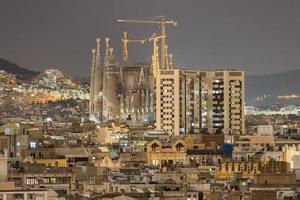 Aerial view of the Barcelona Skyline and the Sagrada Familia at night in Catalonia, Spain, 2022 photo