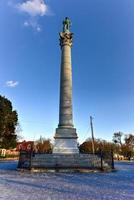 Confederate Soldiers' and Sailors' Monument. It depicts a bronze Confederate private standing on top of the pillar, which is composed of 13 granite blocks to symbolize each of the Confederate states. photo