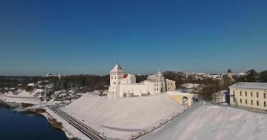 flight and aerial winter panoramic view overlooking the old city and medieval castle with snow video