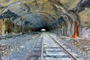 Train tracks going through the Bergen Arches of Jersey City, New Jersey. photo