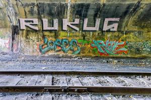 Train tracks going through the Bergen Arches of Jersey City, New Jersey. photo