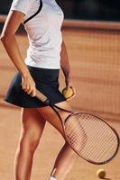 Close up view. Female tennis player is on the court at daytime photo