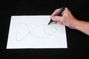 Drawing on a White Paper photo