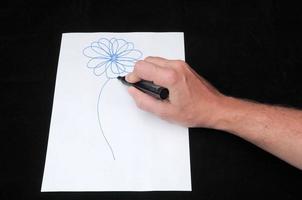 Drawing on a White Paper photo