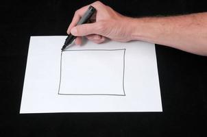 Drawing on a White Paper photo