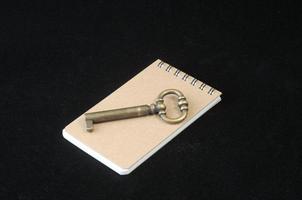 Brown note paper with key photo