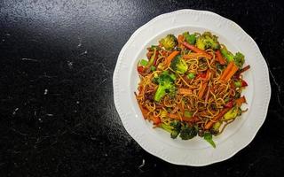 Asian fried noodles with vegetables photo