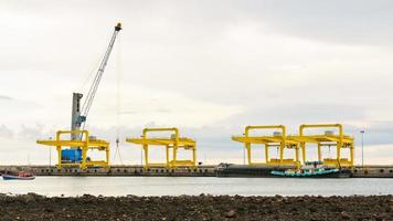 Harbor crane on the sea photo