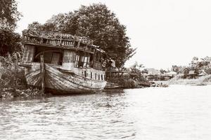 Vintage style old damaged wooden boat photo