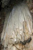 Stalactite and stalagmite in Tham Lod cave photo