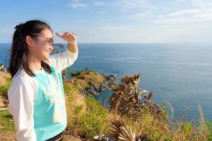 Women tourists looking at beautiful nature sea photo