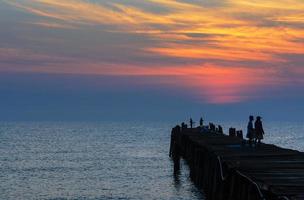 Fishing pier at sunrise photo