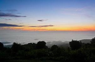 Landscape sea of mist on sunrise view from high mountain photo