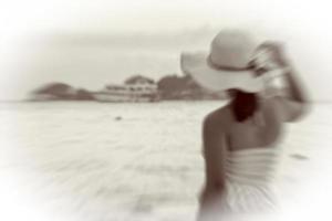 Woman on the beach vintage blur style photo
