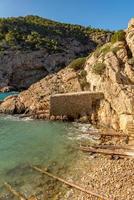 Turquoise waters in Es Portitxol, Ibiza, Spain. Hidden bay on the Island of Ibiza, in Sant Joan de Labritja. photo