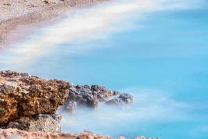 Cala Salada and Saladeta in san Antonio Abad at Balearic Islands Spain. Long exposure, Typical house for fishing boats and rocks. photo