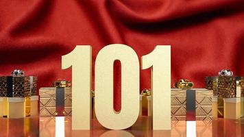 gold number 101 and gift box on red silk for business concept photo
