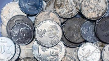 pile of rupiah coins as background photo