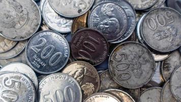 pile of rupiah coins as background photo