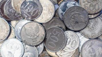 pile of rupiah coins as background photo