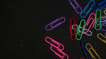 Paper clip isolated on a black background photo
