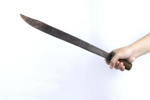 hand holding machete isolated on white background photo