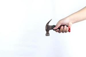 hand holding hammer isolated on white background photo