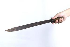 hand holding machete isolated on white background photo