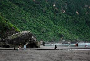 Beach with Green Coral Cliffs photo