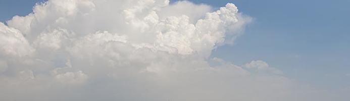 Image of a partly cloudy and partly clear sky during the day photo